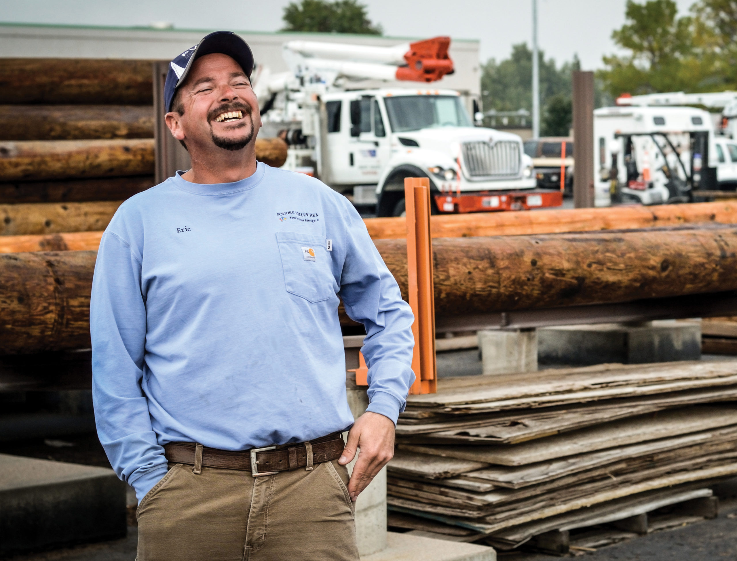 employee smiling in yard