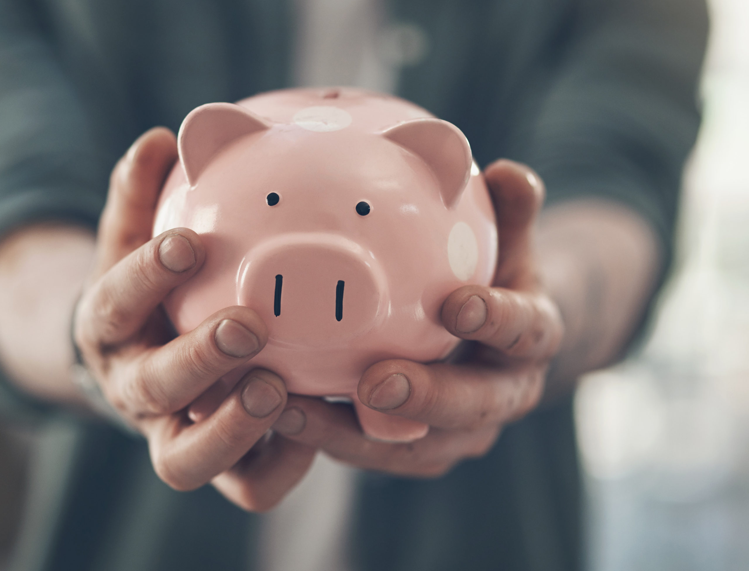 man holding piggy bank