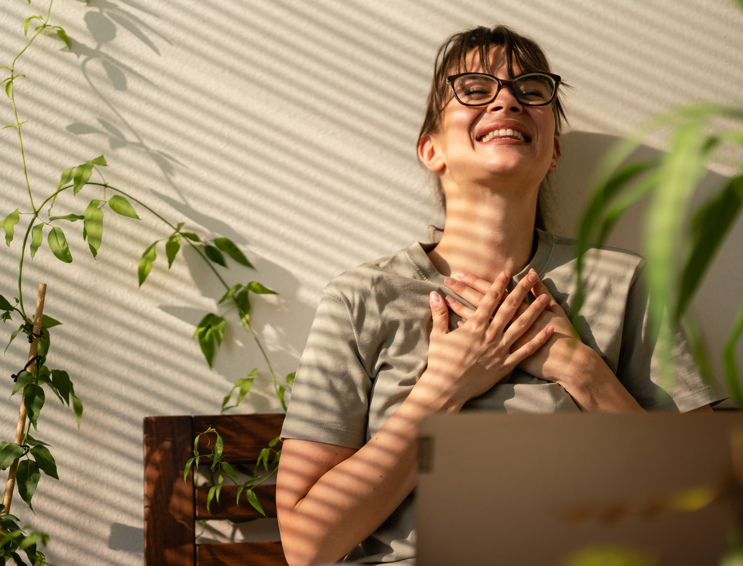 smiling women in front of computer