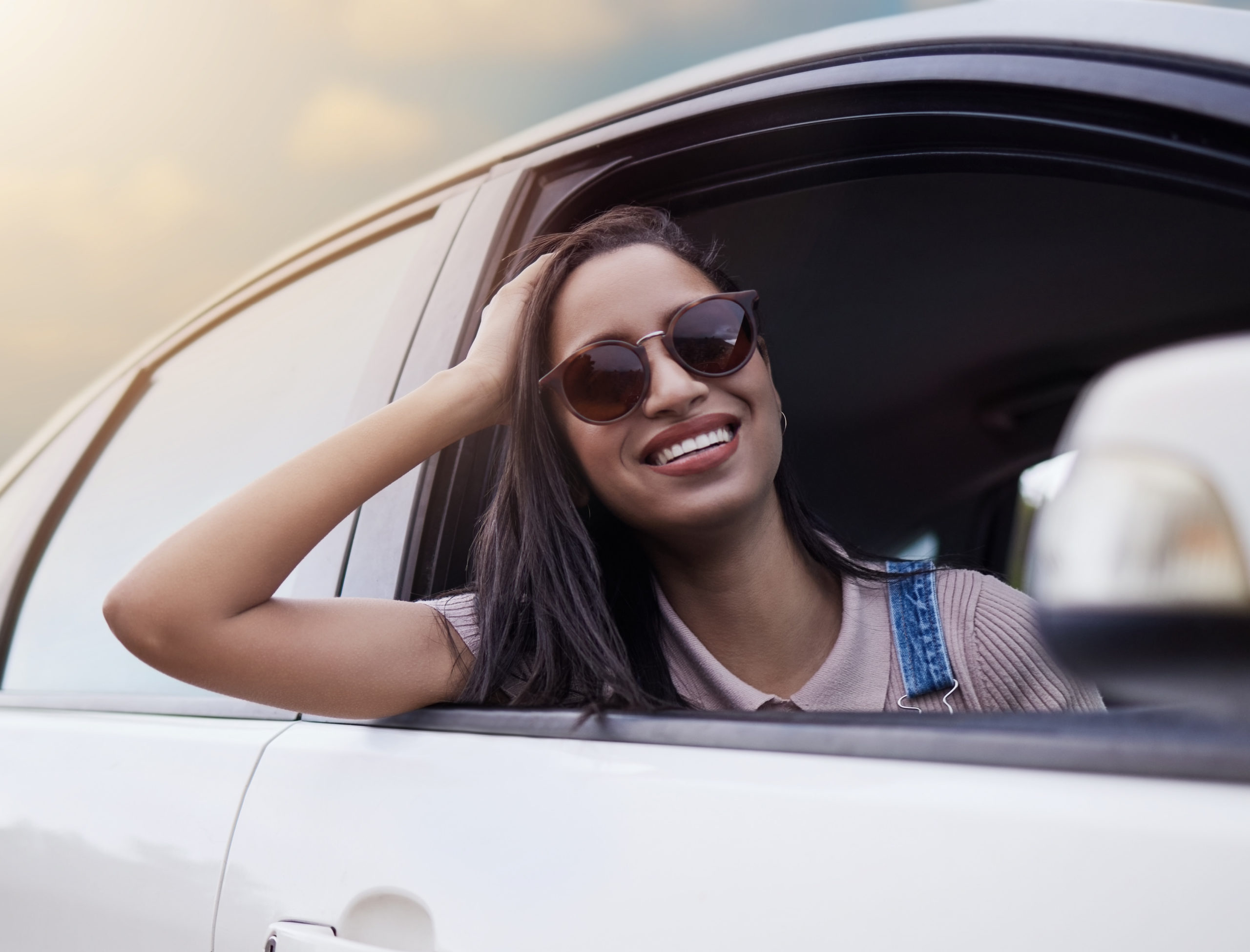 woman smiling in passenger window