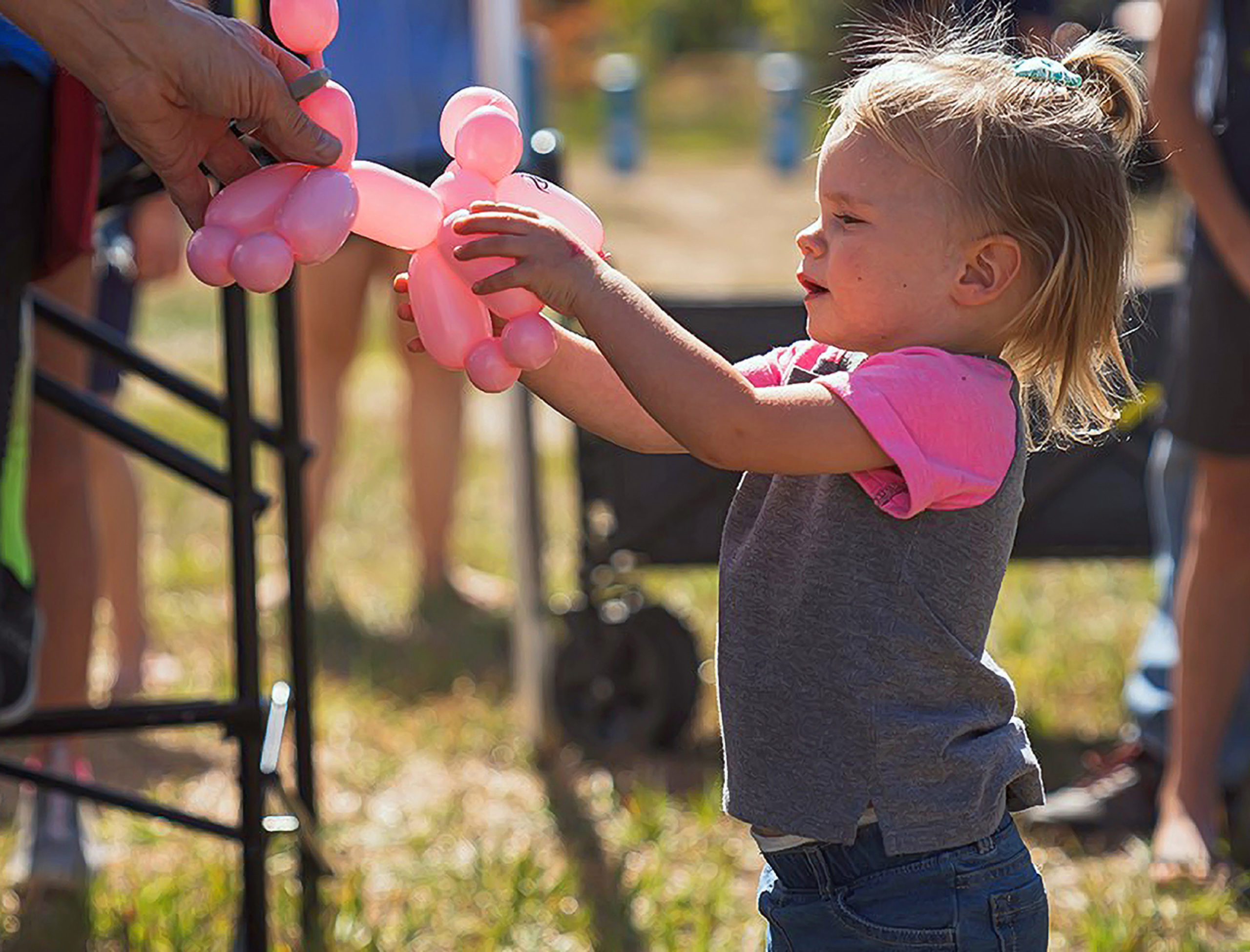 child holding balloon