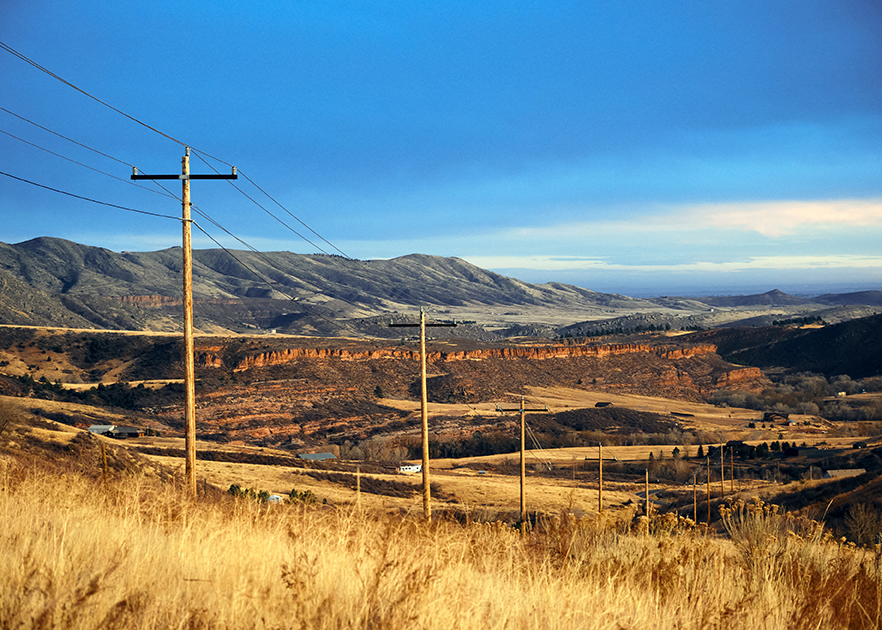 Plains hills with a bluff and powerlines