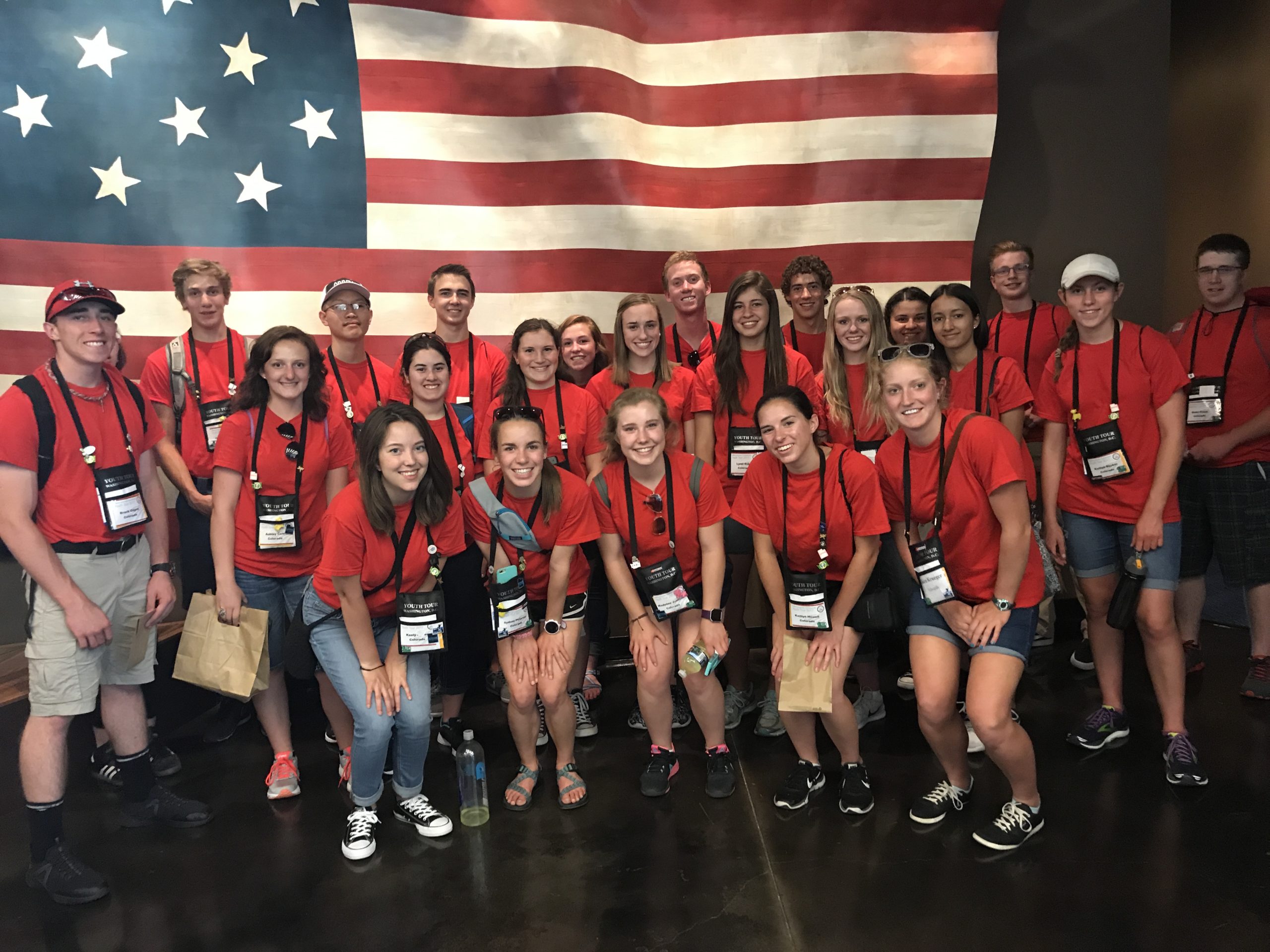 Students in front of flag