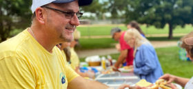 Community member handing out food