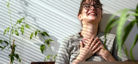 smiling women in front of computer