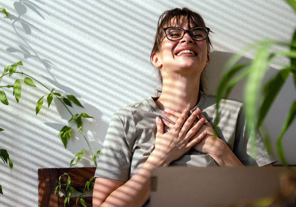 smiling women in front of computer