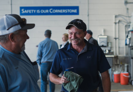 Employees gathered together smiling