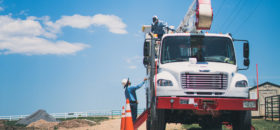 line workers at truck