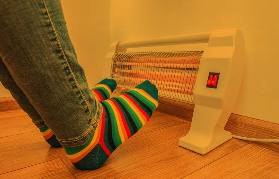 Wearing socks in front of a space heater